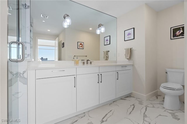 bathroom featuring toilet, a shower with shower door, and vanity