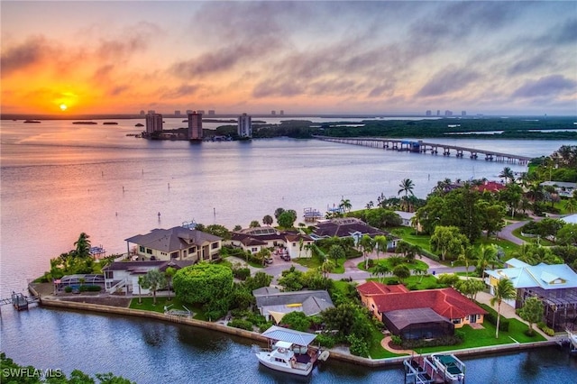 aerial view at dusk with a water view