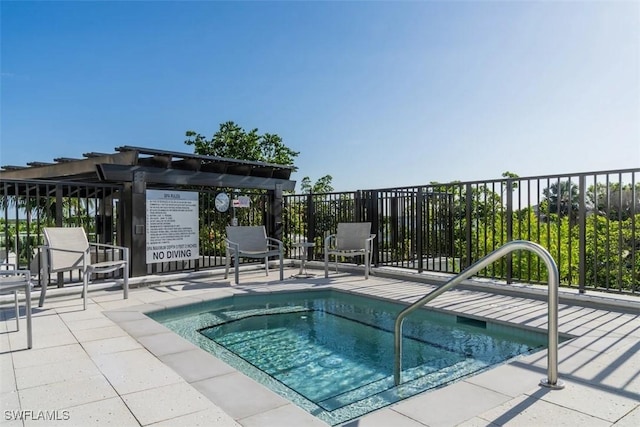 view of swimming pool featuring a pergola and a patio