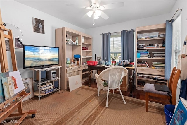 home office with carpet floors and ceiling fan