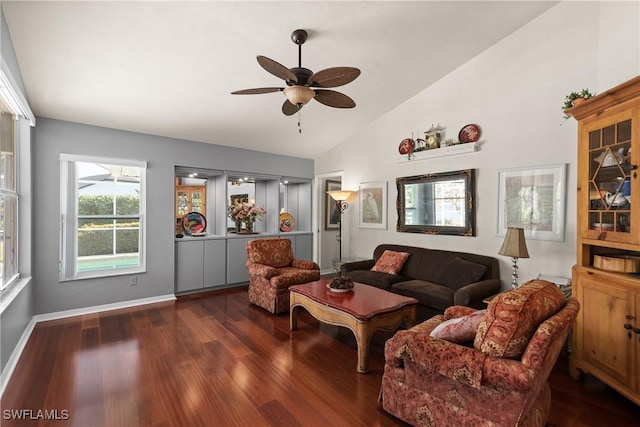 living room with lofted ceiling, ceiling fan, and dark hardwood / wood-style floors