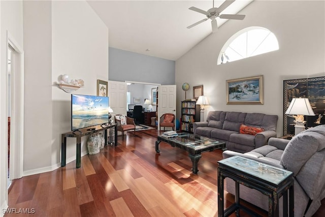 living room with high vaulted ceiling, hardwood / wood-style floors, and ceiling fan