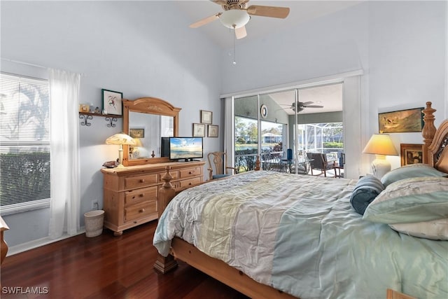 bedroom with ceiling fan, vaulted ceiling, multiple windows, and dark hardwood / wood-style floors