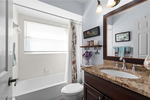 full bathroom with toilet, shower / bath combo with shower curtain, and vanity