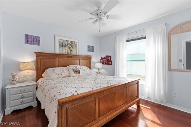 bedroom featuring ceiling fan and dark hardwood / wood-style floors