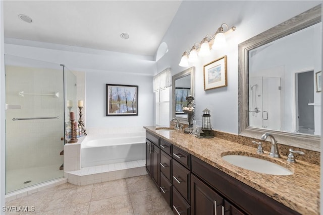 bathroom with vanity, tile patterned flooring, vaulted ceiling, and plus walk in shower