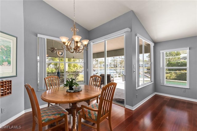 dining space featuring lofted ceiling, a chandelier, and dark hardwood / wood-style floors