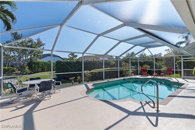 view of pool with a lanai and a patio area