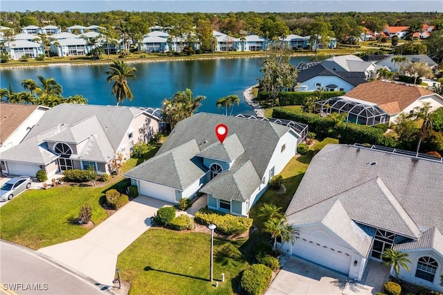 birds eye view of property with a water view