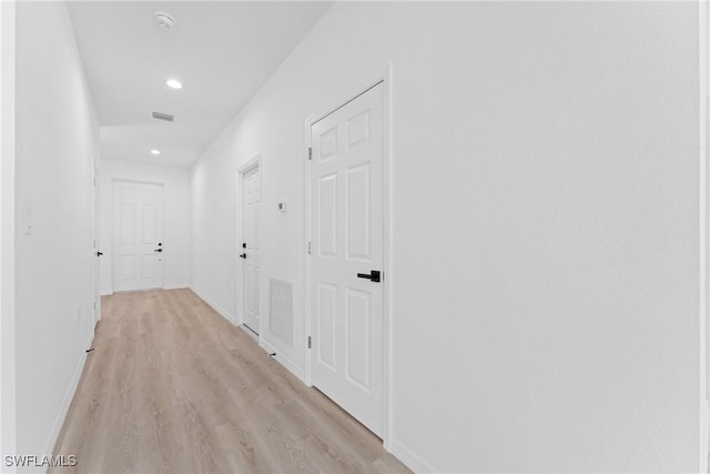 hallway with light wood-type flooring