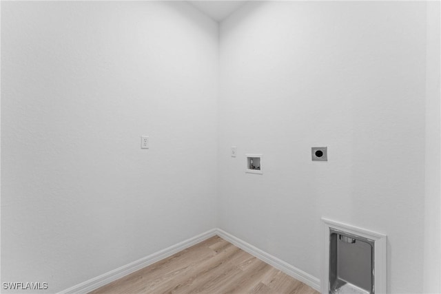 laundry room featuring hookup for an electric dryer, hookup for a washing machine, and light wood-type flooring