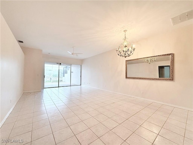 unfurnished room featuring light tile patterned floors and ceiling fan with notable chandelier