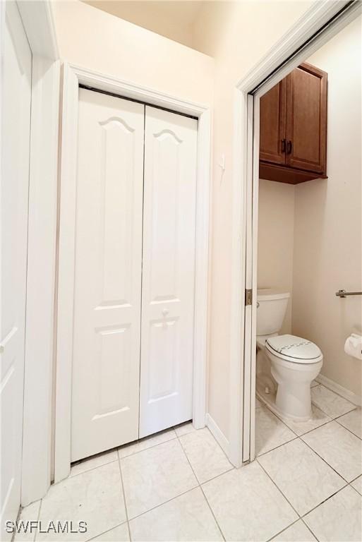 bathroom featuring tile patterned flooring and toilet