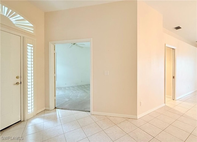 entryway featuring ceiling fan and light tile patterned floors