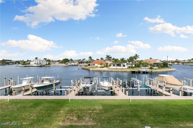 view of dock featuring a water view and a lawn