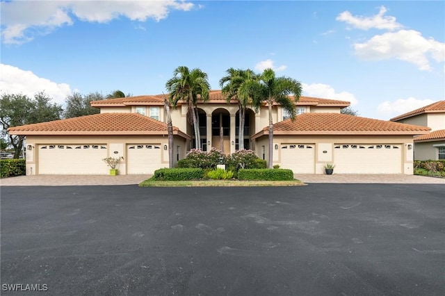 mediterranean / spanish-style home featuring a garage