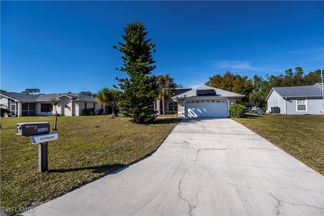 ranch-style house featuring a garage and a front yard