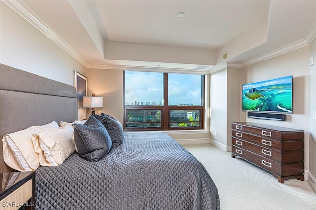 bedroom featuring light carpet, baseboards, a tray ceiling, and ornamental molding