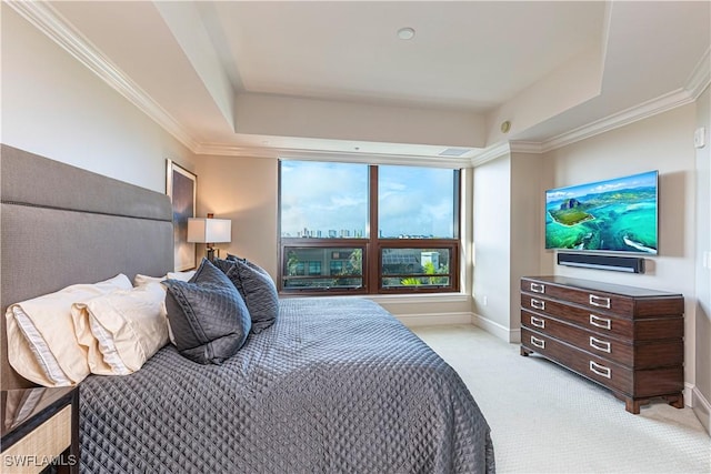 bedroom with light carpet, ornamental molding, baseboards, and a tray ceiling