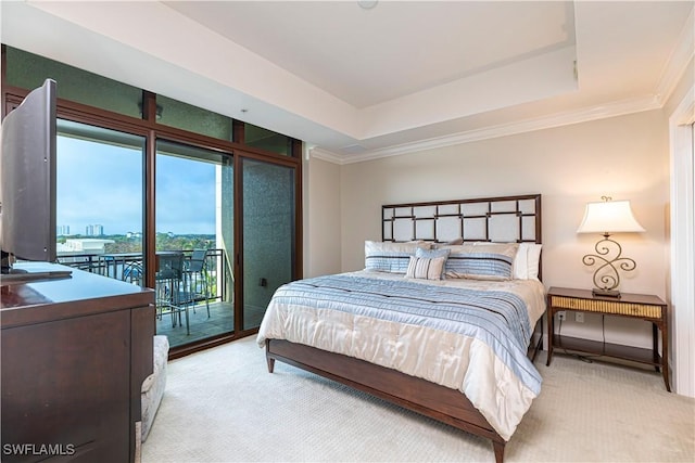 bedroom with access to exterior, a raised ceiling, crown molding, and light colored carpet