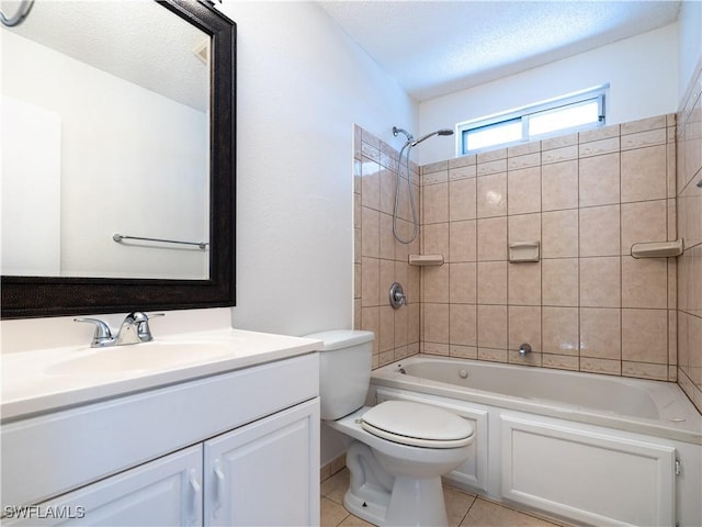 full bathroom with tiled shower / bath combo, tile patterned floors, a textured ceiling, toilet, and vanity