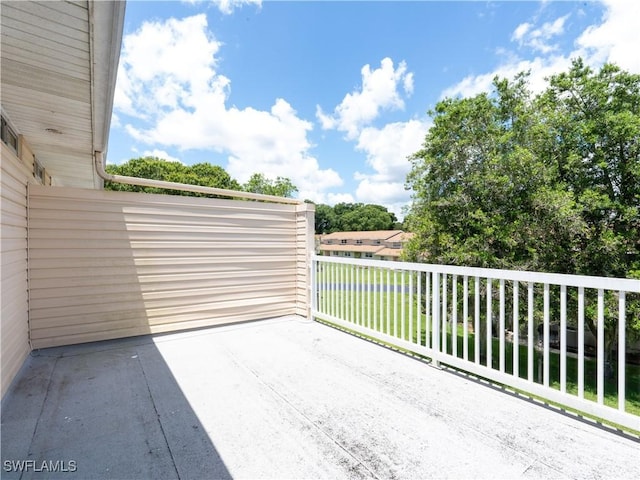 view of patio featuring a balcony