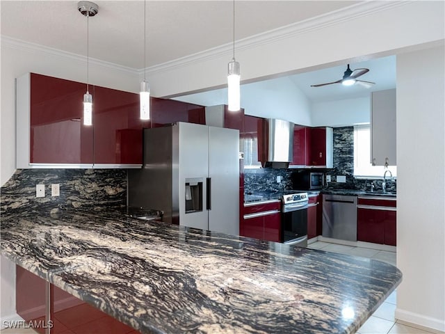 kitchen featuring ceiling fan, sink, stainless steel appliances, pendant lighting, and decorative backsplash