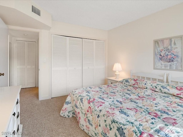 carpeted bedroom with a closet