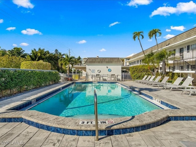 view of swimming pool featuring a patio area