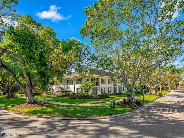 ranch-style home featuring a front yard