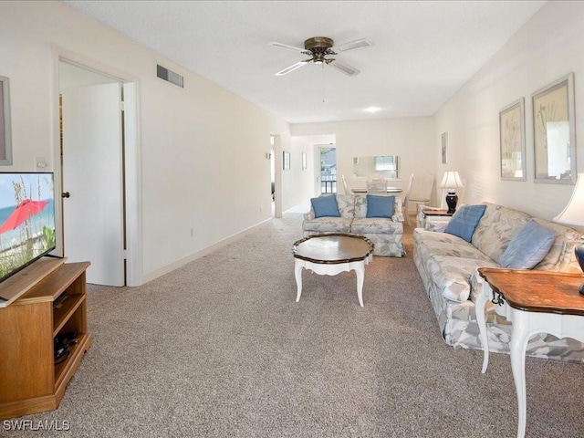 living room featuring ceiling fan and light carpet