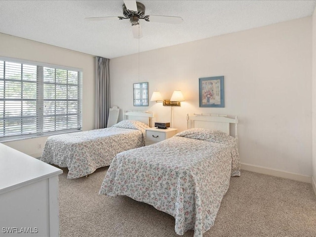 bedroom featuring light carpet and ceiling fan