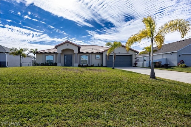 mediterranean / spanish house with a garage and a front lawn