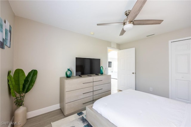 bedroom featuring ceiling fan and light wood-type flooring