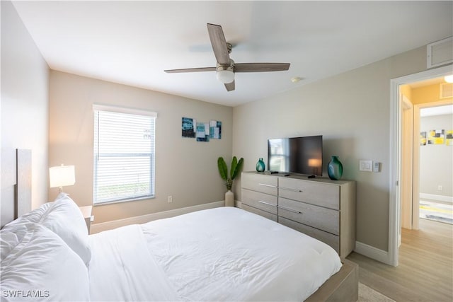 bedroom featuring light hardwood / wood-style floors and ceiling fan