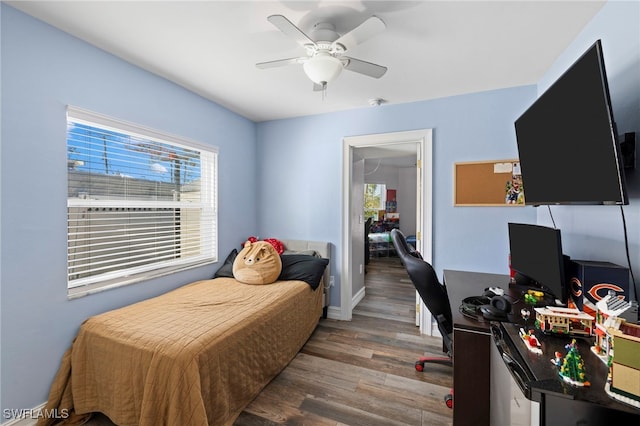4560 Key Largo Ln, Bonita Springs, FL 34134 - bedroom featuring wood finished floors, multiple windows, an office area, and ceiling fan
