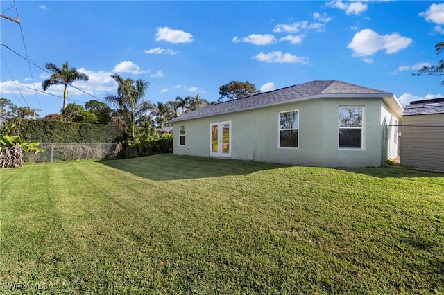 4560 Key Largo Ln, Bonita Springs, FL 34134 - back of house with stucco siding, french doors, and roof with shingles
