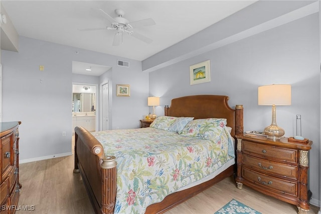 bedroom featuring light wood-type flooring, connected bathroom, and ceiling fan