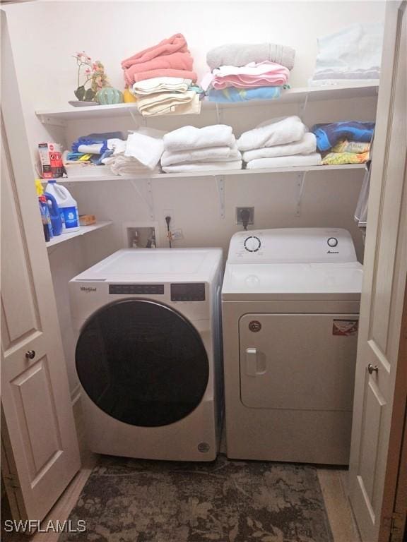 laundry room featuring separate washer and dryer