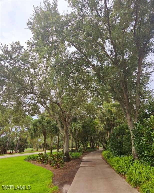 view of home's community featuring a lawn