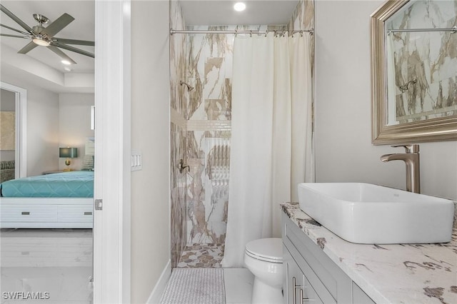 bathroom featuring a shower with shower curtain, ceiling fan, toilet, and vanity