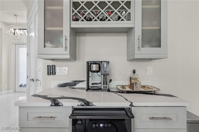 kitchen featuring range and an inviting chandelier