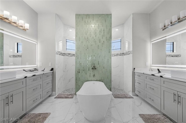 bathroom with vanity and independent shower and bath