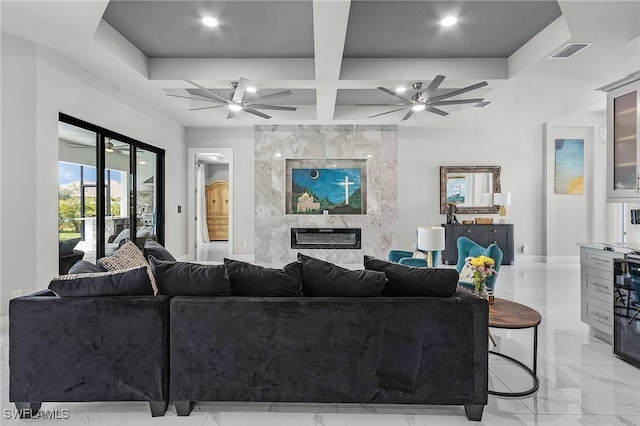 living room with a high end fireplace, beam ceiling, and coffered ceiling