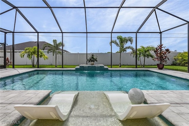 view of swimming pool with a lanai, pool water feature, and a patio