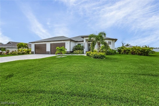 view of front of property featuring a garage and a front lawn