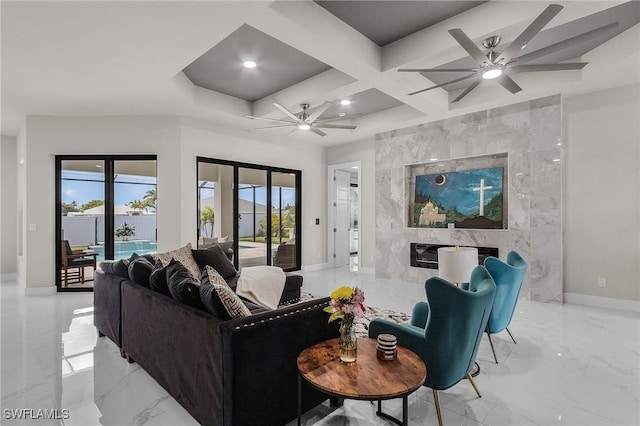 living room with a fireplace, ceiling fan, and coffered ceiling