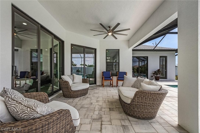 view of patio with outdoor lounge area and ceiling fan