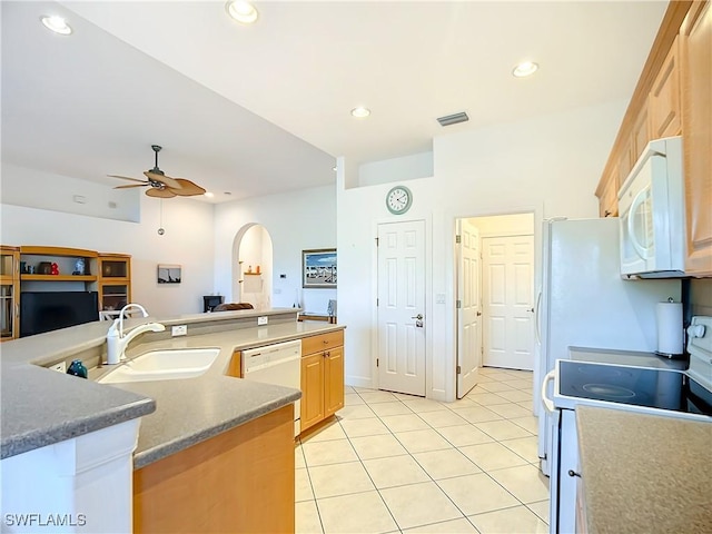 kitchen featuring sink, white appliances, ceiling fan, light tile patterned flooring, and light brown cabinets