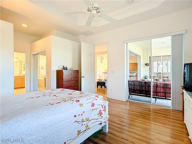 bedroom featuring ensuite bath, ceiling fan, and light hardwood / wood-style floors